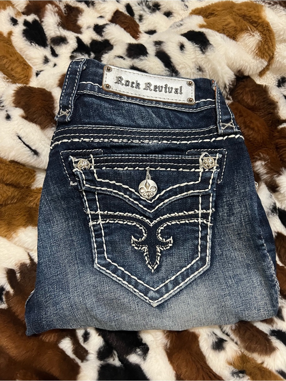 Rock Revival Dark Wash Blue Jeans with Embroidered Fleur-de-Lis Pockets